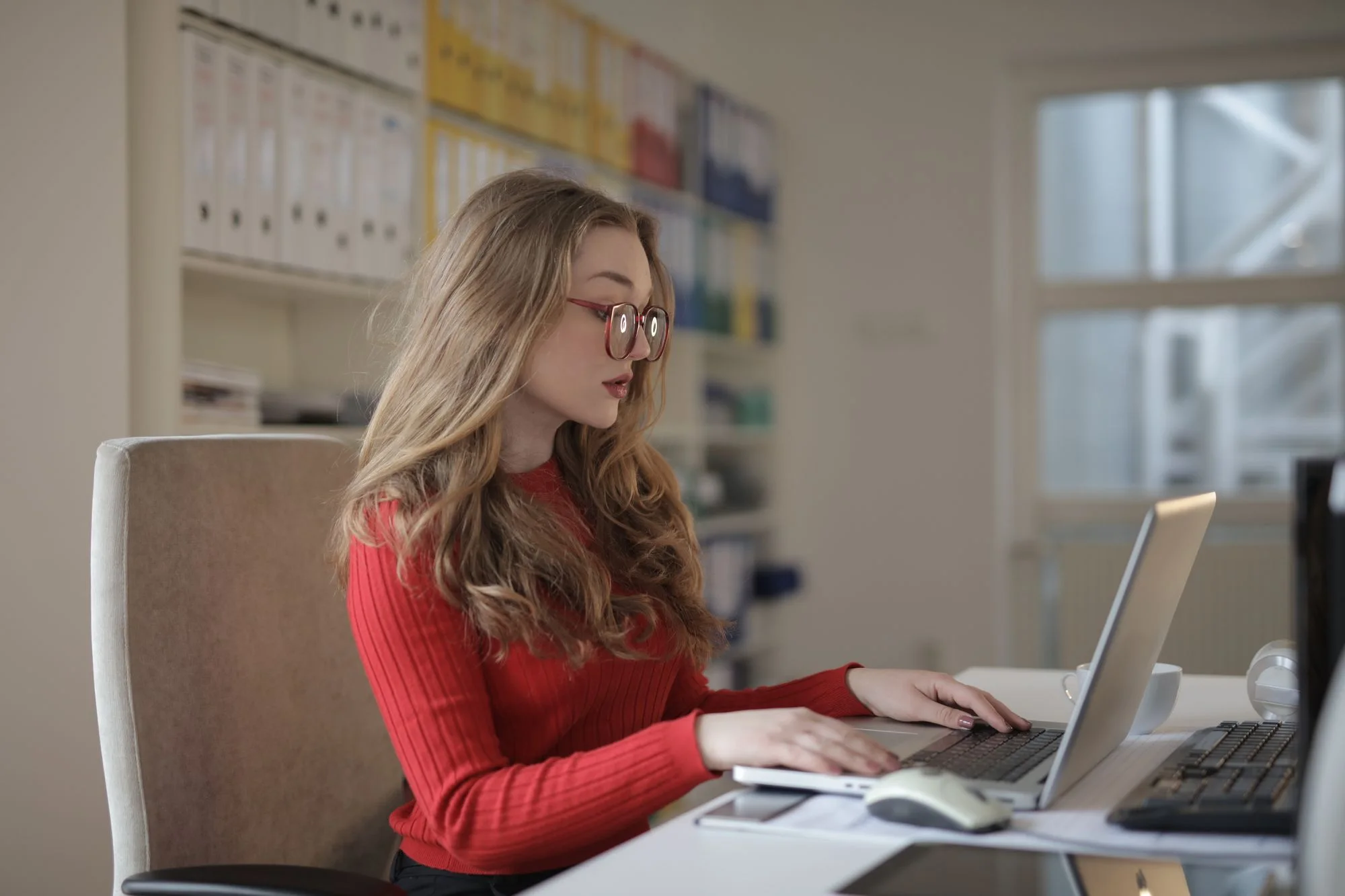 A professional working at a laptop
